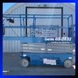 Blue Genie GS-2632 electric scissor lift, side view, platform lowered with guardrails raised