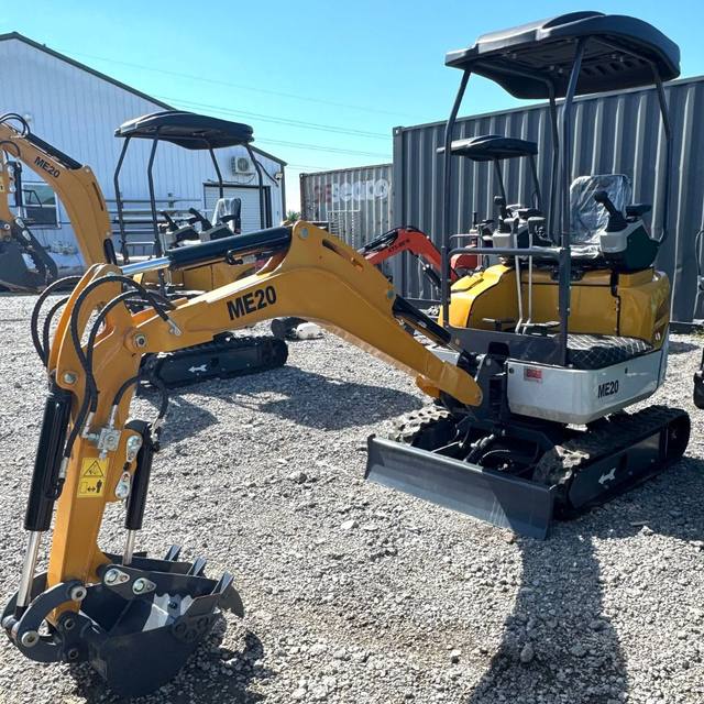 ME20 mini excavators parked side by side, yellow booms, open canopies, rubber tracks, toothed buckets and push blades