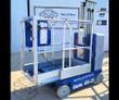 Genie GR-20 Runabout mast lift in blue, platform interior with control panel, guardrails and the mast behind