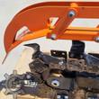 GIYI trencher digging chain with bolt-on cutter teeth and the orange crumber arm pinned above it