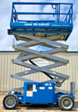 Blue Genie GS-3369RT rough-terrain scissor lift extended, raised scissor stack and knobby tires