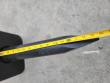 Tape measure laid along the SB40's black moil point chisel from the housing to the tip