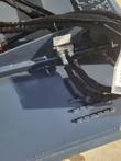 WIG brush cutter deck top: model XN-QG01-72 data plate, sleeved hydraulic hoses and a manifold block