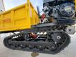 Mini dumper side view, rubber track undercarriage and 420cc gasoline engine below the yellow bed