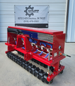 AGT no-till seed drill: red hopper, seed tubes and packer wheels, three-point mount