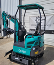Teal QK16R mini excavator with canopy, rubber tracks, dozer blade and bucket with grapple thumb