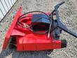 Red disc mulcher from above: black hydraulic drive motor, coiled hoses with quick-connect couplers and mount