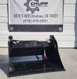 Black 4-in-1 skid steer bucket below the Chupp Industrial banner, hydraulic hose and red-capped coupler