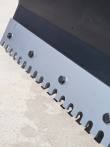 Serrated bolt-on cutting edge of the push blade, mounting bolts and tooth pattern