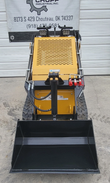 AGT MX-MRT14 mini skid steer with black loader bucket, rubber tracks, LED work lights and red hydraulic couplers