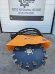 Arteer transverse stump grinder head: full cutting wheel face, bolted hub, teeth around the rim, orange shield above