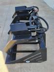 72-inch root grapple bucket at an angle, dual clamps and cylinders, GIYI plate on the quick-attach frame