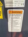 WIG asphalt block crusher spec plate: 25-32 GPM, 1646 lbs, and safety warning label