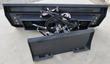 Rear of the 6-way dozer blade: moldboard back, angle and tilt cylinders, hoses and detached mount plate