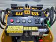AGT CRT23 controls: twin hand levers, fuel and oil-temp gauges, hour meter, rocker switches, key and red stop button