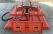 Topcat 68-inch brush cutter deck, orange, quick-attach plate, hydraulic motor and hoses unspooled alongside