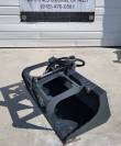 Gray flat-bottom grapple bucket with closed grapple arm, hydraulic cylinder and sleeved hoses