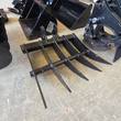 Root rake attachment with five curved tines, mini excavator attachment set