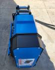 Blue Raytree drum mulcher from above: pin-on mount, chain guard down one side, spec placard on the end cover