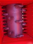 Crushing rotor drum studded with replaceable conical alloy teeth, fixed breaker bars on both sides