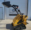 AGT MX-CRT23 mini skid steer with loader arms raised and the black bucket held at full height on rubber tracks