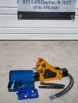 Yellow and black hydraulic breaker with two chisels, tool box, nitrogen charging kit and hydraulic hose