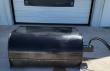 Black box broom sweeper, curved steel hood and hydraulic hose coupling on the right end