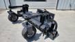 Landhonor power rake, angled view, gauge wheels and rotor teeth, quick-attach plate