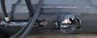 Close view of the Arteer mixer discharge: round steel outlet with a cross-bar on the drum body and hydraulic hose