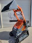 AGT YSRT14 stand-on mini skid steer, orange loader arms with a gray bucket, vented engine cowl and rubber tracks