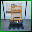 Arteer SS-15000G logging winch, orange mesh guard, cable drum and four anchor blades, framed by a green border