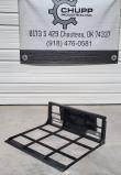 Black steel land leveler with open grid frame and flat cutting edge, below the Chupp Industrial banner