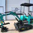 Teal AGT MH12RX mini excavator in profile: boom, digging bucket and thumb, backfill blade, canopy and rubber tracks
