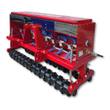 Red AGT no till seed drill: stainless-topped seed hopper, blue seed tubes to the row openers, toothed packer roller