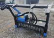 Raytree drum mulcher on the quick-attach frame, blue motor housing and black toothed drum rotor