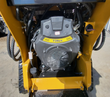 AGT MX-CRT23 739cc gasoline engine mounted in the yellow frame with hydraulic lines and inline fuel filter