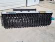 AGT angle broom, full row of black bristle wafers on the core with hydraulic drive motor at one end