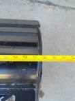 Tape measure across the tilt bucket's top edge, reading 32 inches