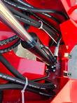 Hydraulic hoses and lift cylinder routed through the AGT SDA-140T mini skid steer frame