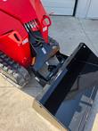 Quick-attach mount and hydraulic couplers on the AGT SDA-140T mini skid steer loader arm