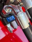 Hydraulic hose fitting and coupler on the AGT SDA-140T mini skid steer loader arm