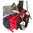 Tire changer turntable and clamps, grease pot and bead breaker pedal, angled view