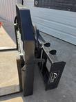 ARTEER decal on the pallet fork carriage upright, quick-attach hooks and fork heel
