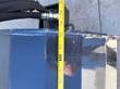 Tape measure held against the Arteer box broom's front corner near the mount cylinder