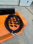 Coiled hydraulic hoses and quick-connect couplers on the Arteer rock rake