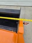Tape measure at the rake housing's mounting corner on the Arteer 74in rock rake