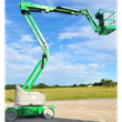 Green articulating boom lift with gray turret, boom raised and extended sideways, empty work platform at the end