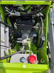 ATS T460 mini skid steer engine bay with hydraulic hoses, pump, and fluid reservoir, cover raised