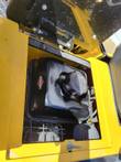 FF15 engine bay with the hood open: Briggs & Stratton fuel tank and cap, B&S badge, engine and air intake below
