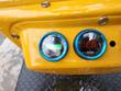 DM12-C gauges: hour meter reading 0.0 hours next to a DC voltmeter showing 12.8 volts, blue bezels on the yellow console